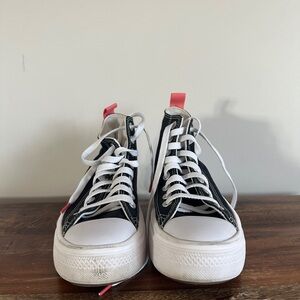 Black and White High-Top Sneakers with Pink Accents